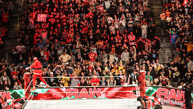 Fans watch ”WWE Monday Night RAW” at Wells Fargo Arena in Des Moines.